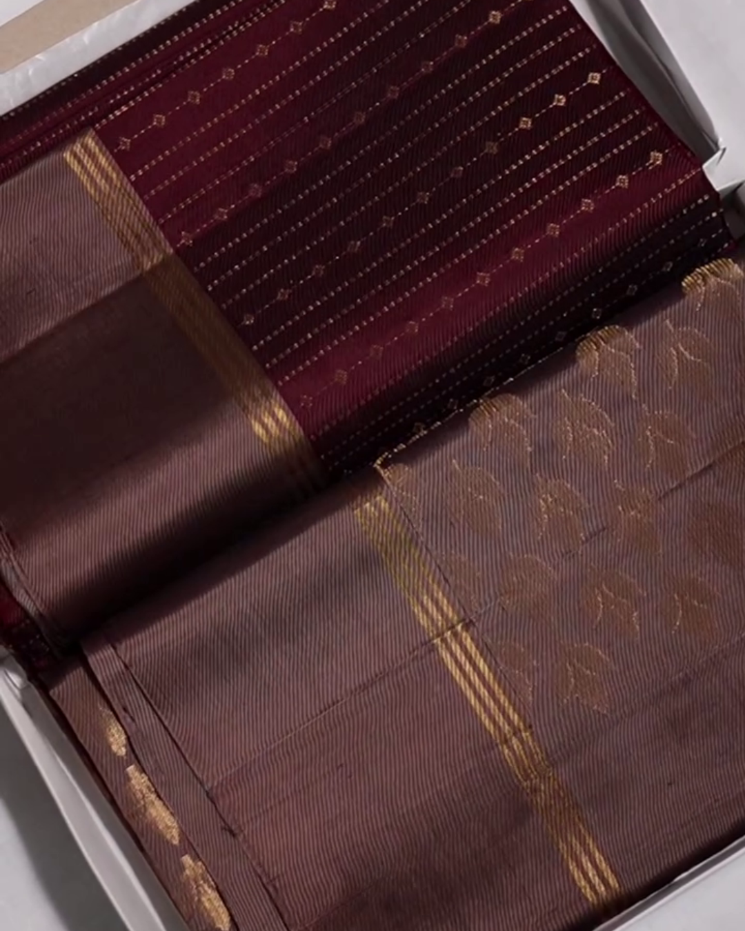 Yamika – Maroon Katan Silk Saree with Gold Zari Stripes and Leaf Motifs