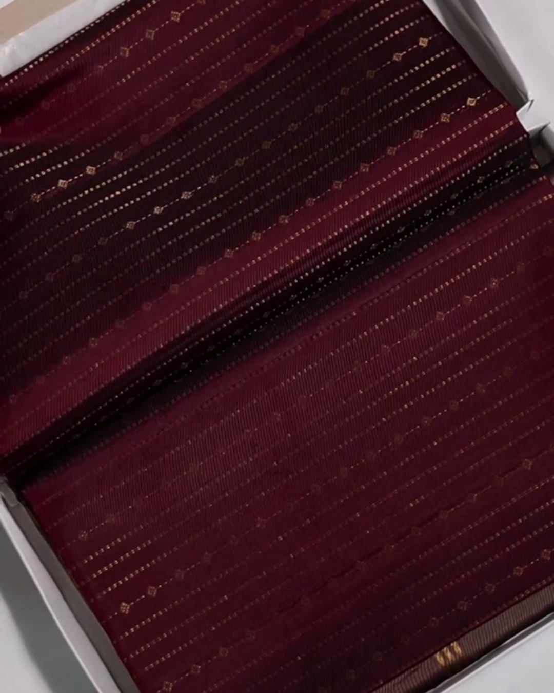 Yamika – Maroon Katan Silk Saree with Gold Zari Stripes and Leaf Motifs
