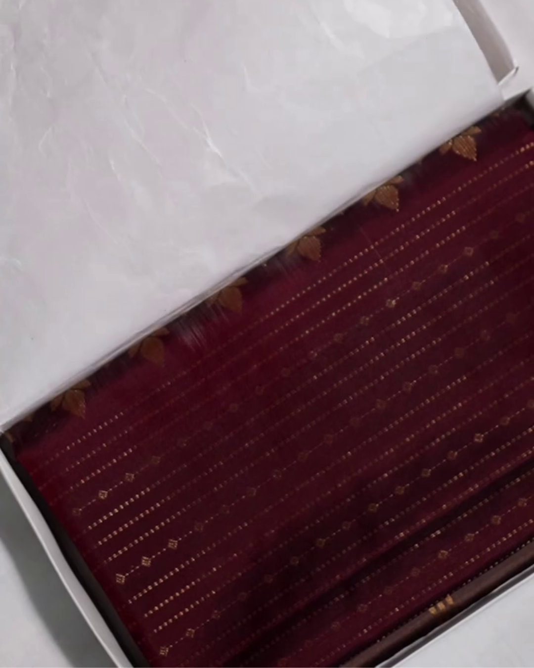 Yamika – Maroon Katan Silk Saree with Gold Zari Stripes and Leaf Motifs