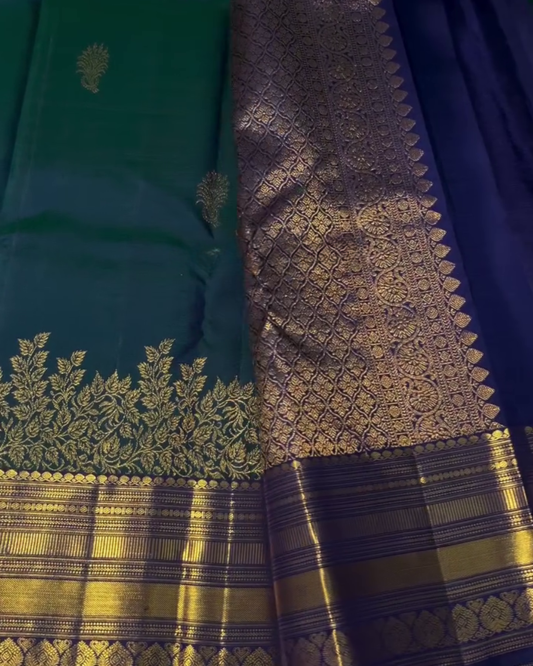 Sharvitha – Green and Navy Kanyaaram Silk Saree with Heavy Golden Zari Border and Floral Pallu