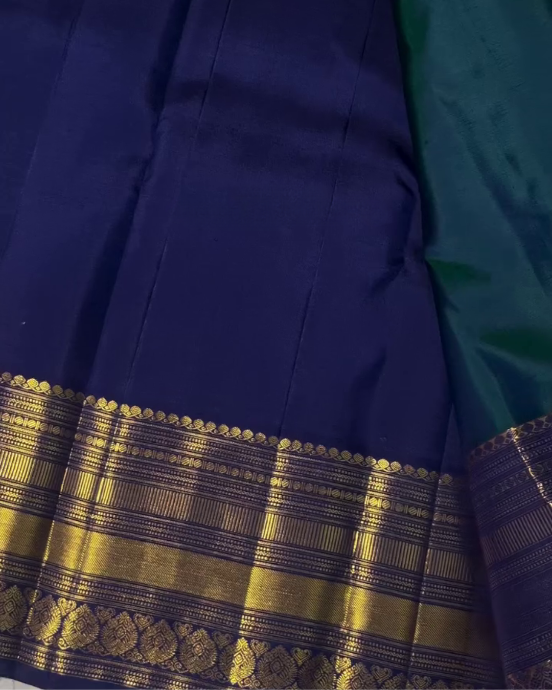 Sharvitha – Green and Navy Kanyaaram Silk Saree with Heavy Golden Zari Border and Floral Pallu