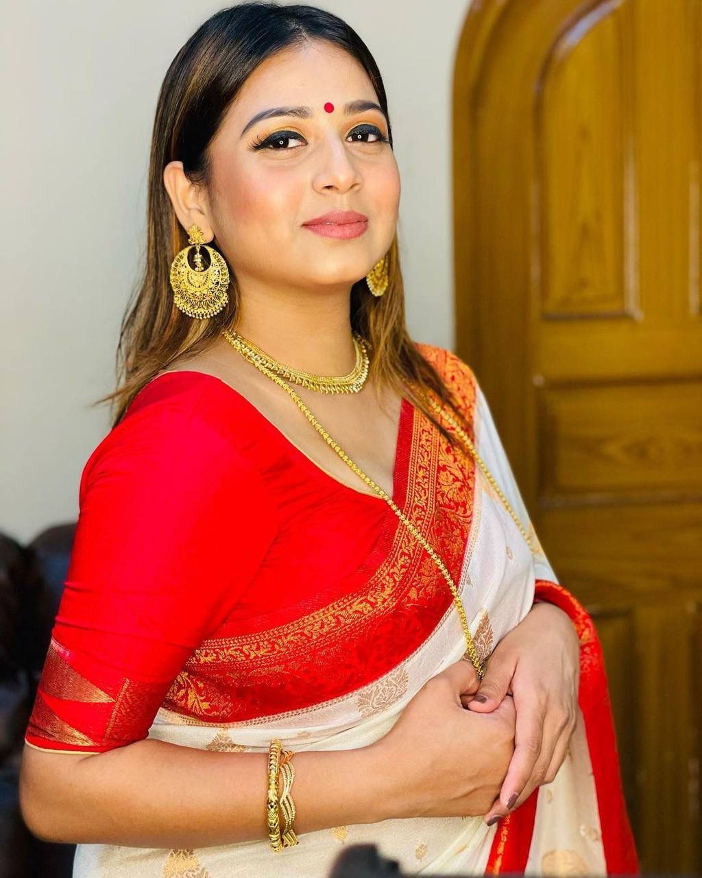 Sreemati - White Silk Saree with Golden Zari Motifs and Red Border