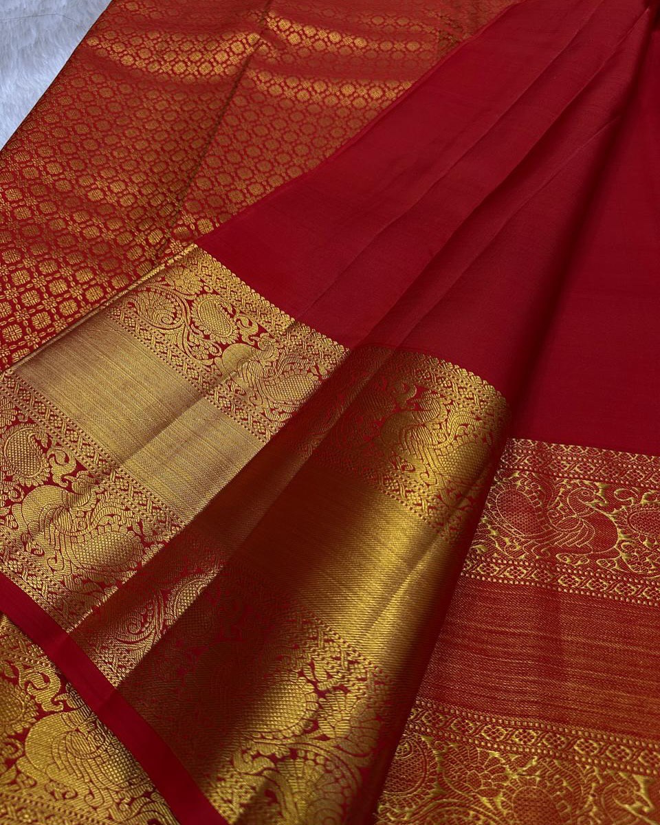 Shruti – Vermilion Red Banarasi Soft Silk Saree with Gold Butti & Regal Peacock Border