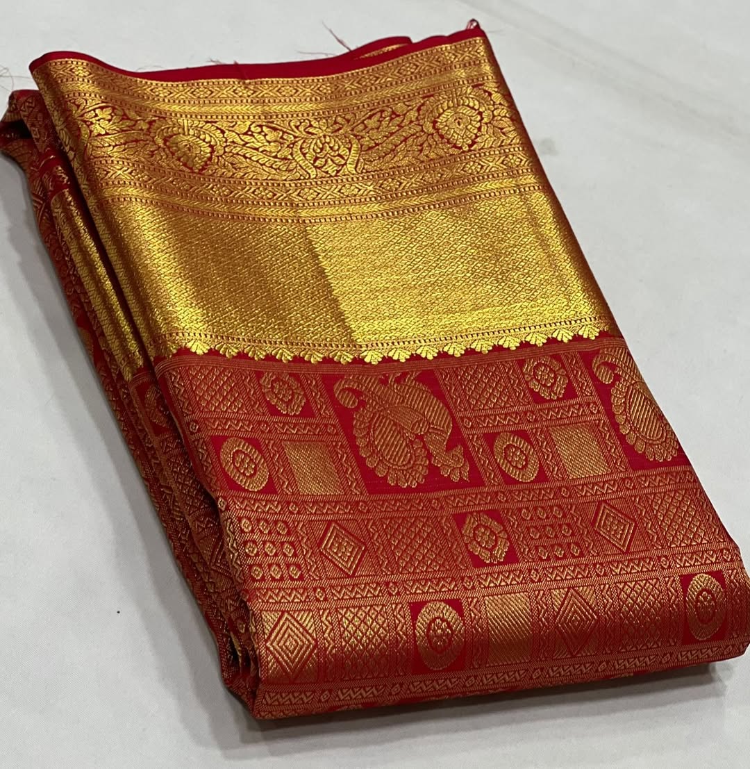 Uma – Vermilion Red Banarasi Soft Silk Saree with Peacock Zari Checks & Grand Floral Pallu