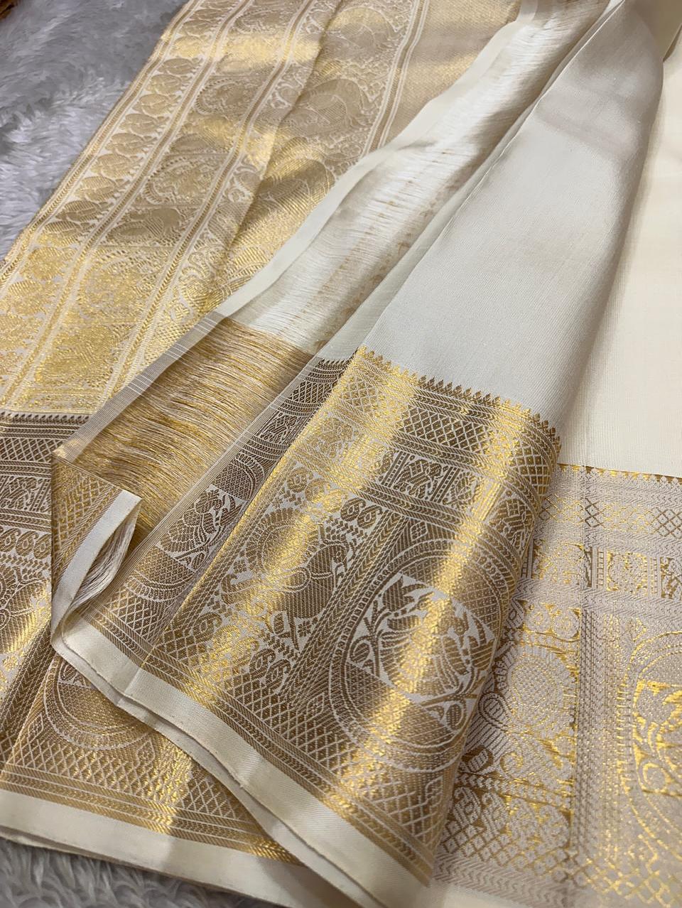 Dakshayani – Off White Banarasi Soft Silk Saree with Gold Zari Butti & Grand Border