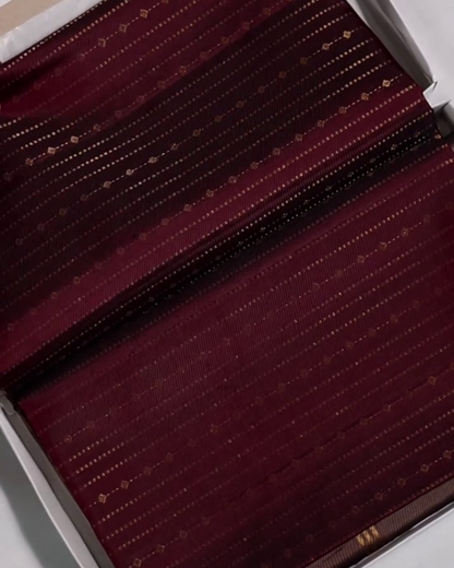Yamika – Maroon Katan Silk Saree with Gold Zari Stripes and Leaf Motifs