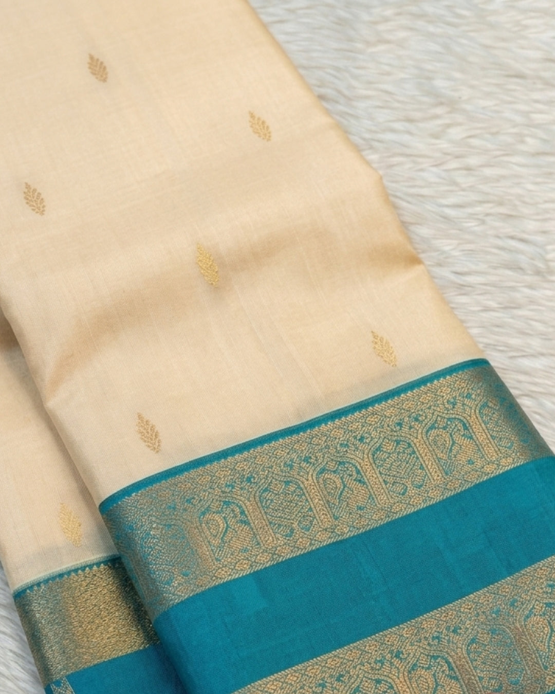 Deny - Cream Teal Zari Paisley Border Silk Saree