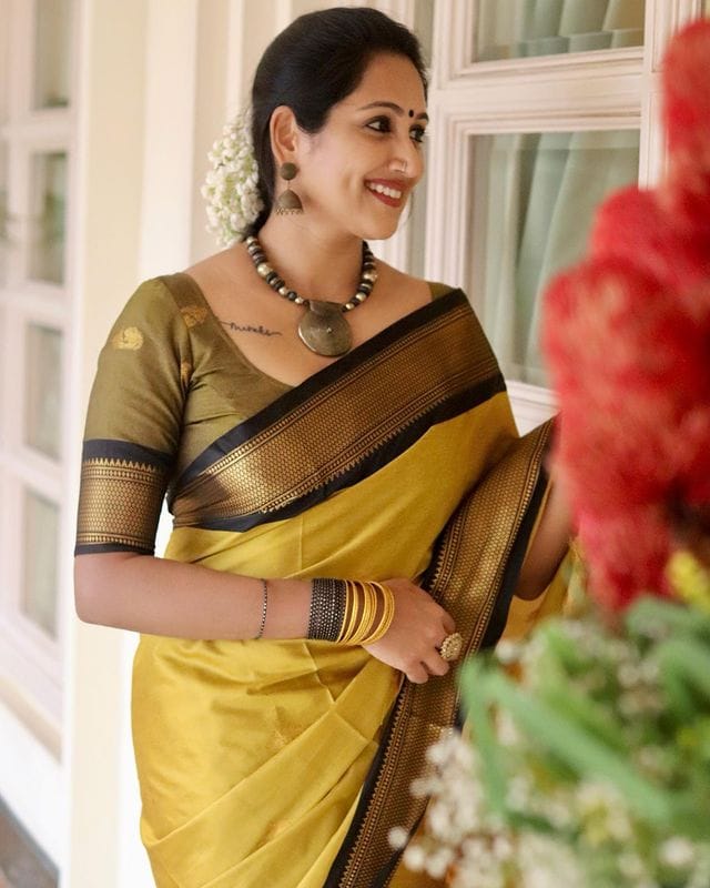 Radiant Yellow-Black Banarasi Silk Saree with Exquisite Jacquard Detailing and Elegant Border-RITIKA