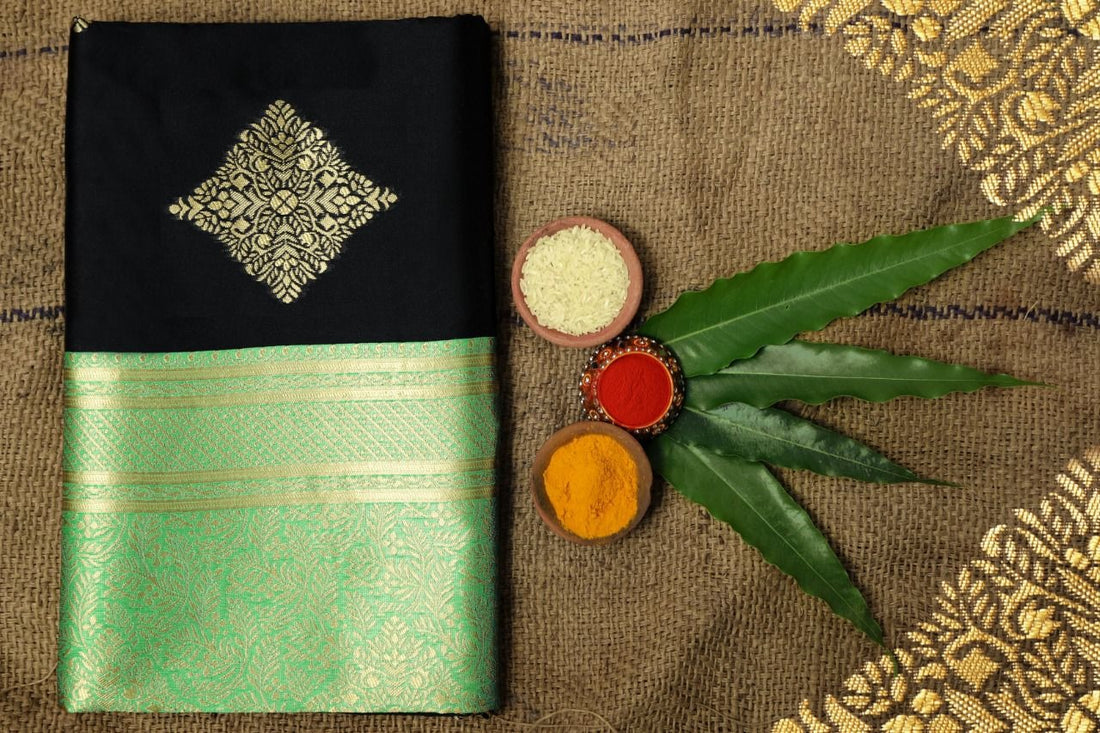 Shravya - Black Soft Silk Saree with Mint Green Zari Border and Gold Motifs