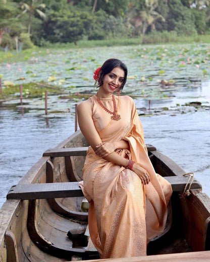 Jenisha Light Peach Banarasi Silk Saree With Fabulous Blouse Piece