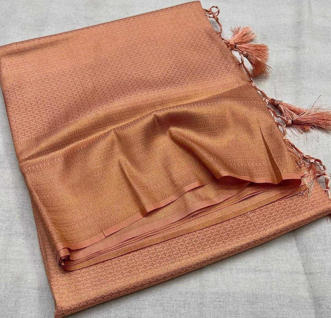 Tamanna Peach Colored KanchiSoft  Silk Saree With Charming Blouse Piece