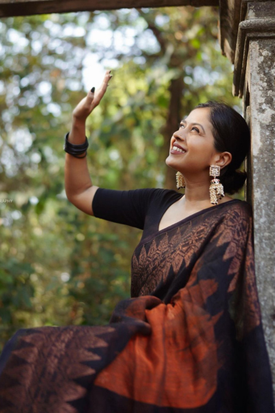 Jenna Reddish Orange Black Silk Saree